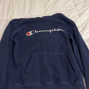 Blue champion hoodie (says large but run small) I’d say it’s a medium or a small